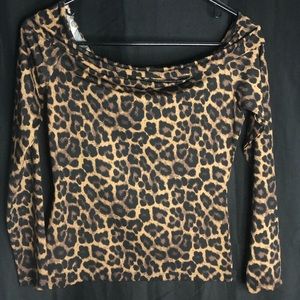 Off the shoulder cheetah print shirt.